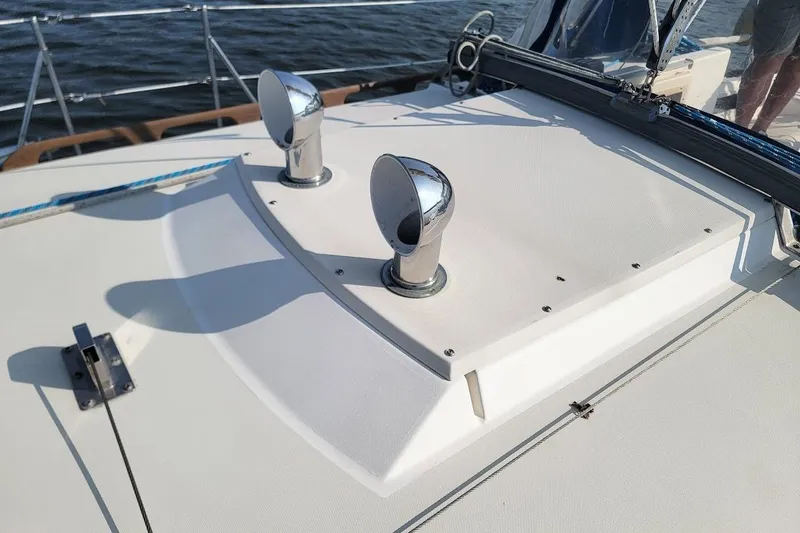 Slide: The Image of 1987 Pearson 39-2 sailboat deck with chrome vents, featuring 2016 Beta engine. - 28