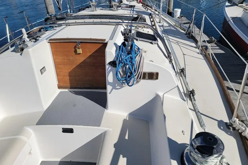 Slide: The Image of 1987 Pearson 39-2 sailboat deck with 2016 Beta engine, docked at marina. - 33
