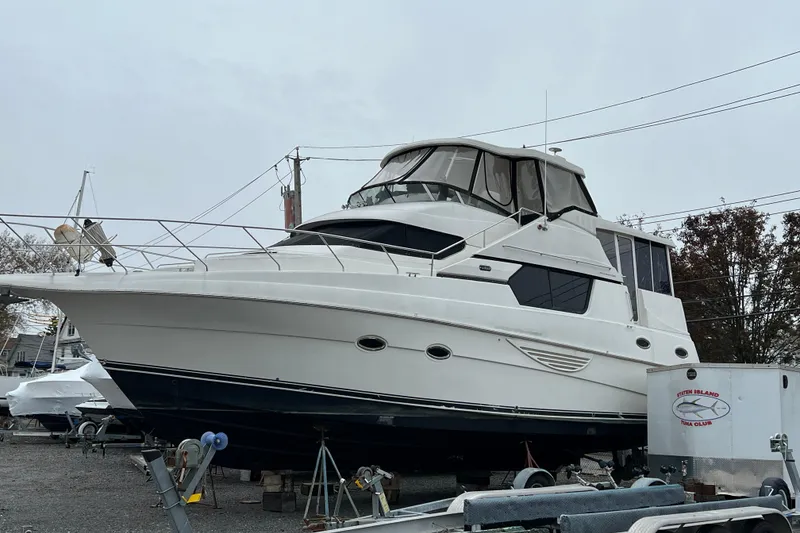 Slide: The Image of 2002 Silverton 453 Motor Yacht on dry dock, side view. - 1