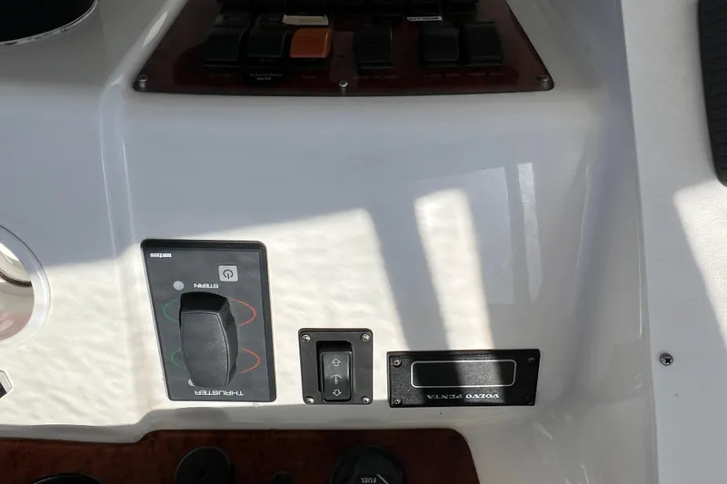 Slide: The Image of Control panel of a 2002 Silverton 453 Motor Yacht with various switches and labels. - 16