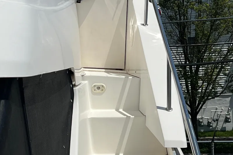 Slide: The Image of 2002 Silverton 453 Motor Yacht deck with railing and outdoor outlet. - 18
