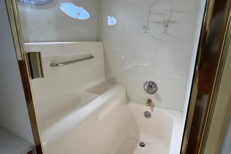 Slide: The Image of Bathroom interior of 2002 Silverton 453 Motor Yacht with shower and fixtures. - 28
