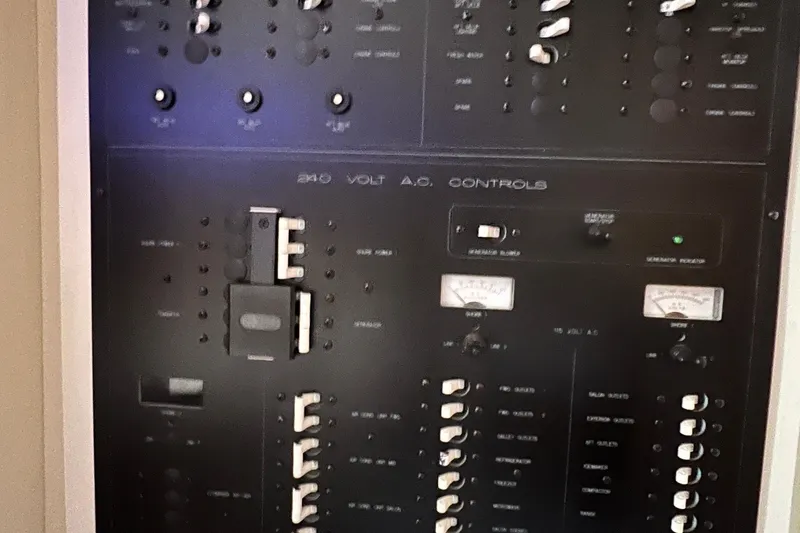 Slide: The Image of Control panel of a 2002 Silverton 453 Motor Yacht, featuring 240-volt AC controls. - 41