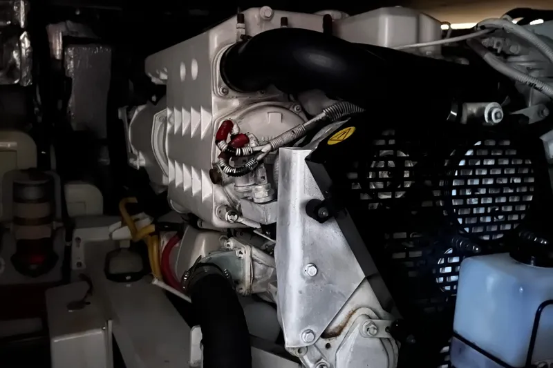 Slide: The Image of Engine room of a 2002 Silverton 453 Motor Yacht, showcasing mechanical components. - 43