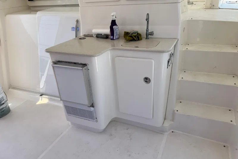 Slide: The Image of 2002 Silverton 453 Motor Yacht interior with sink and storage area. - 8