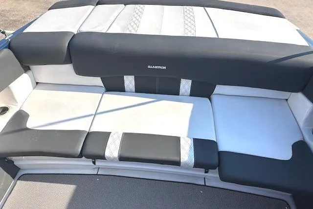 Slide: The Image of 2017 Glastron GT 205 boat interior seating with black and white upholstery. - 13