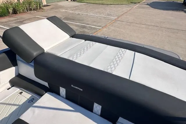 Slide: The Image of 2017 Glastron GT 205 boat interior with sleek black and white seating design. - 20