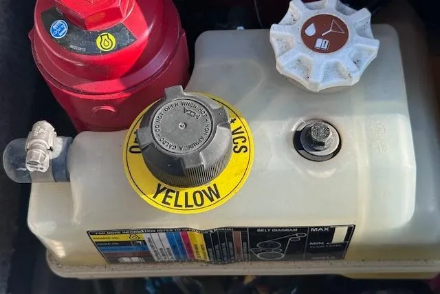 Slide: The Image of Engine compartment of a 2017 Glastron GT 205 boat, featuring hydraulic fluid reservoir. - 25