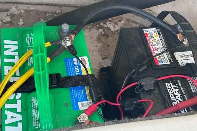 Slide: The Image of Dual batteries in a 2017 Glastron GT 205 boat, featuring Interstate and Super Start brands. - 26