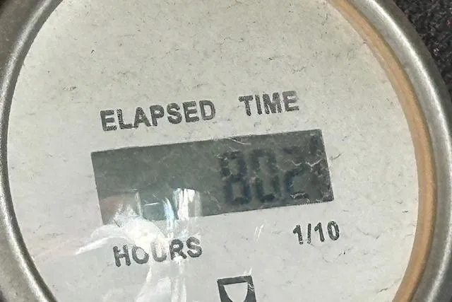 Slide: The Image of Elapsed time gauge showing 802 hours on a 2017 Glastron GT 205 boat. - 28