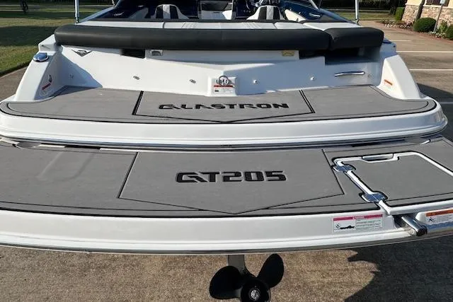 Slide: The Image of 2017 Glastron GT 205 boat, rear view with branding on deck. - 6