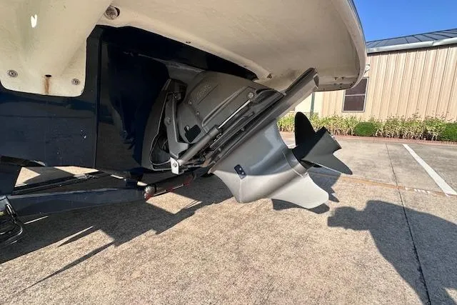 Slide: The Image of 2017 Glastron GT 205 boat stern drive and propeller in a parking lot. - 7