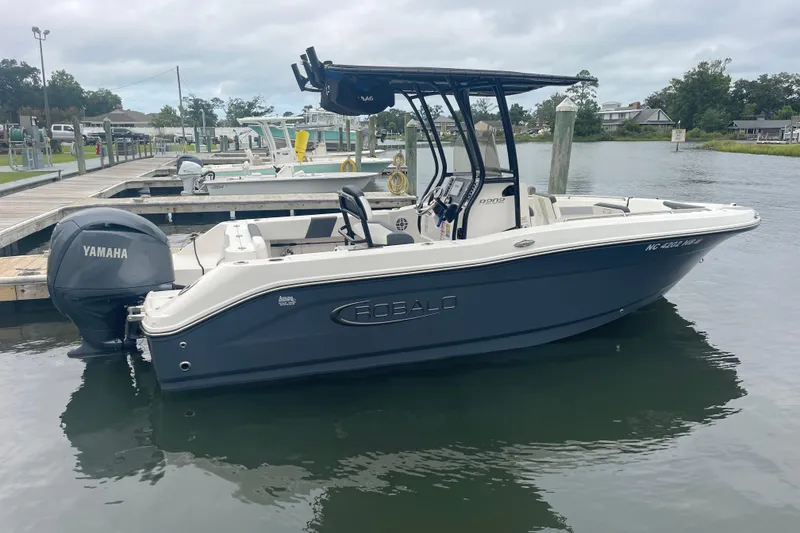 Slide: The Image of 2024 Robalo R202 Explorer boat docked with Yamaha engine. - 2