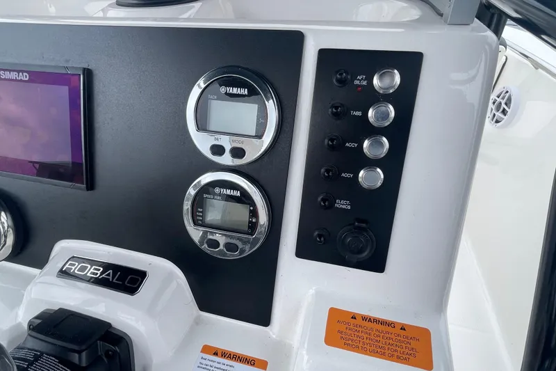 Slide: The Image of 2024 Robalo R202 Explorer dashboard with Yamaha gauges and control panel. - 20