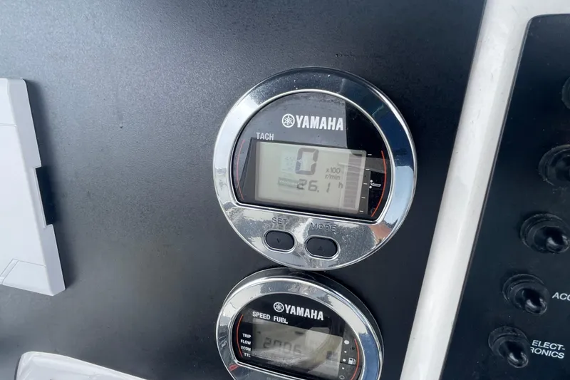 Slide: The Image of Yamaha gauges on 2024 Robalo R202 Explorer dashboard, displaying tachometer and speed fuel readings. - 23