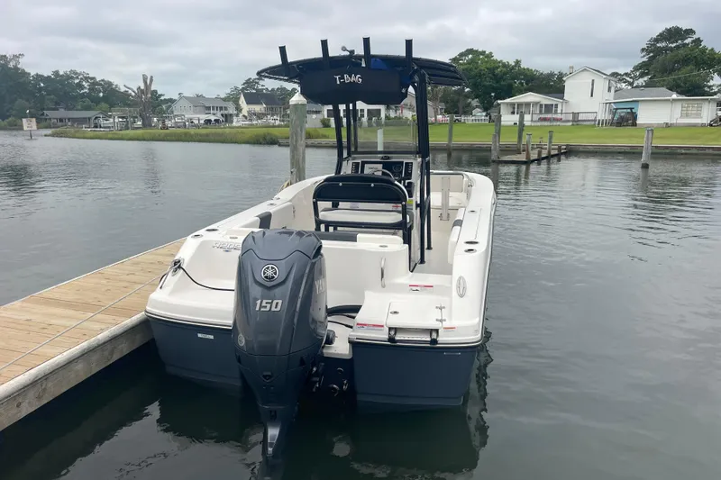 Slide: The Image of 2024 Robalo R202 Explorer boat docked with Yamaha 150 engine. - 3