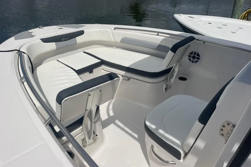Slide: The Image of 2024 Robalo R202 Explorer boat interior with cushioned seating and sleek design. - 37