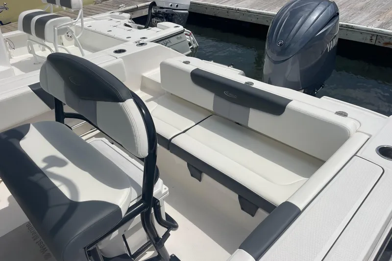 Slide: The Image of 2024 Robalo R202 Explorer boat interior with seating and Yamaha outboard engine. - 38