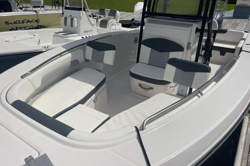 Slide: The Image of 2024 Robalo R202 Explorer boat interior with cushioned seating and sleek design. - 39
