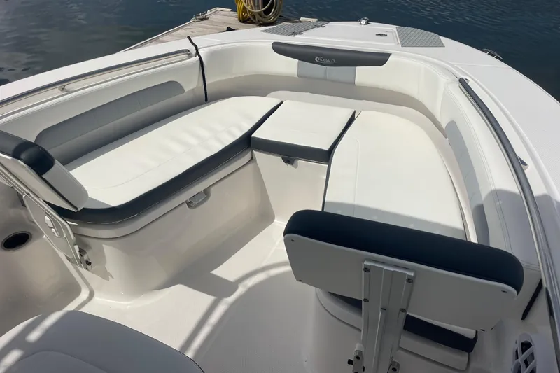 Slide: The Image of 2024 Robalo R202 Explorer boat interior with white seating and sleek design. - 42