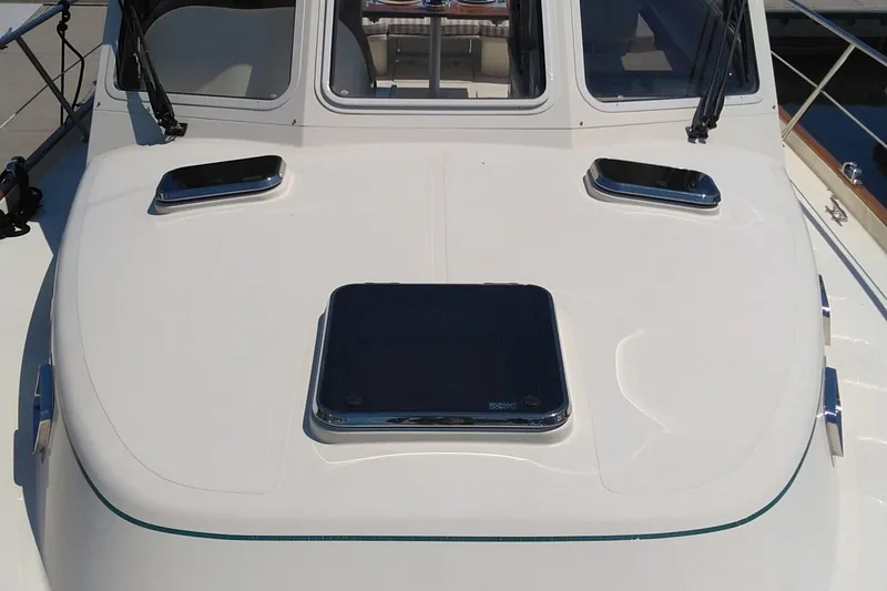 Slide: The Image of 2008 Legacy Yachts 32 deck with hatches and windows, showcasing sleek design. - 19