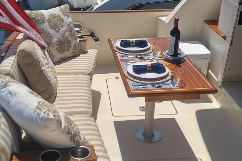 Slide: The Image of Elegant dining setup on 2008 Legacy Yachts 32, featuring wine and nautical decor. - 20