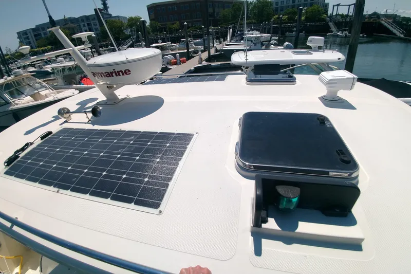 Slide: The Image of 2008 Legacy Yachts 32 with solar panel and radar at marina dock. - 22