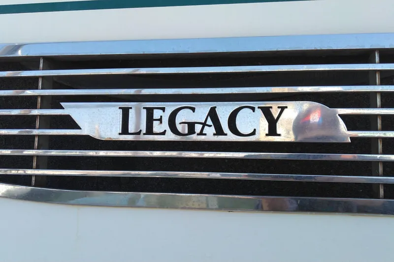 Slide: The Image of Legacy Yachts 32 emblem on a 2008 model, featuring chrome detailing. - 34