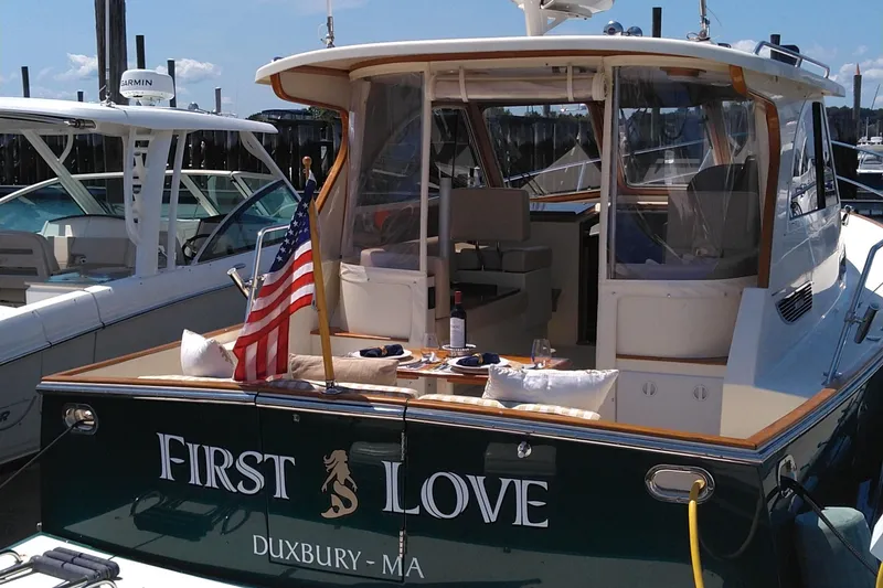 Slide: The Image of 2008 Legacy Yachts 32 named "First Love" docked in Duxbury, MA with American flag. - 37