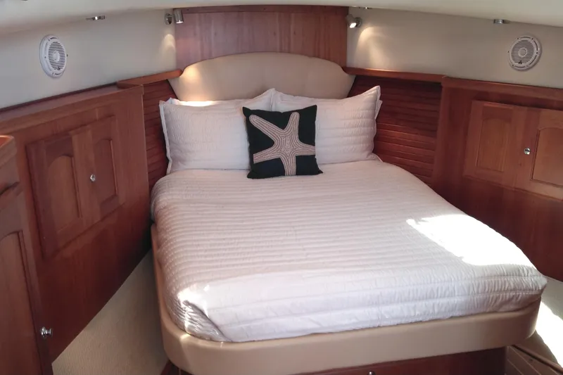 Slide: The Image of Luxurious cabin interior of 2008 Legacy Yachts 32 with cozy bed and wooden finish. - 49