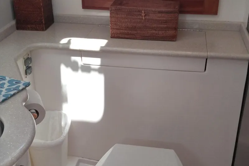 Slide: The Image of 2008 Legacy Yachts 32 bathroom interior with countertop and wicker basket. - 50