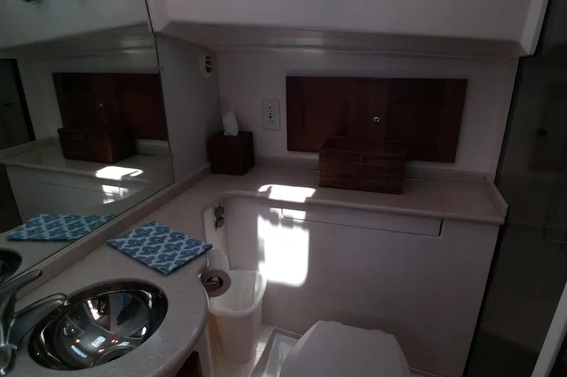 Slide: The Image of 2008 Legacy Yachts 32 bathroom with sink, mirror, and storage cabinet. - 51