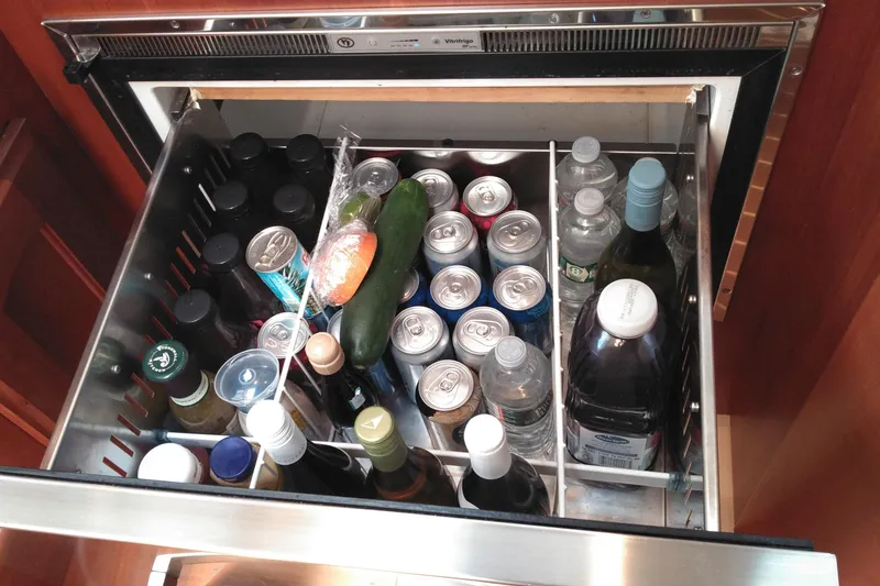 Slide: The Image of Refrigerator drawer on 2008 Legacy Yachts 32, stocked with beverages and vegetables. - 59