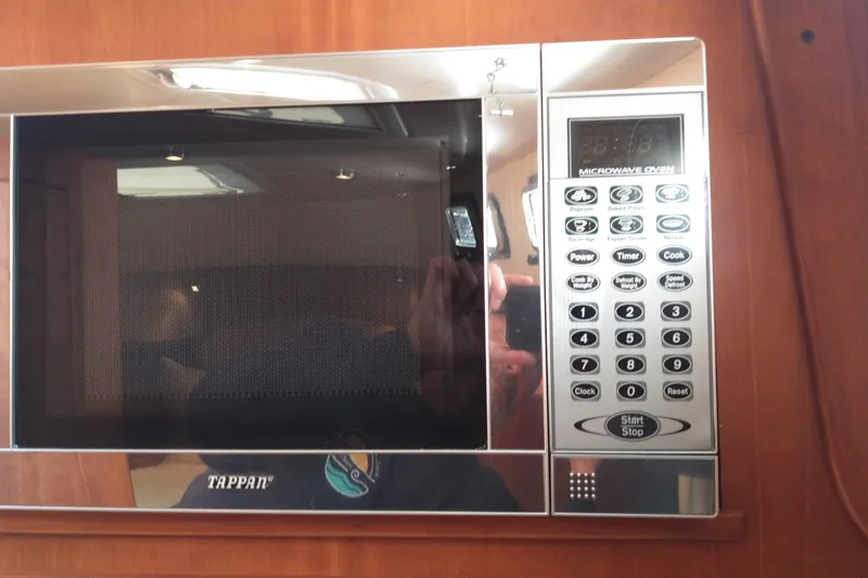 Slide: The Image of Tappan microwave oven in 2008 Legacy Yachts 32 interior, featuring digital controls. - 62