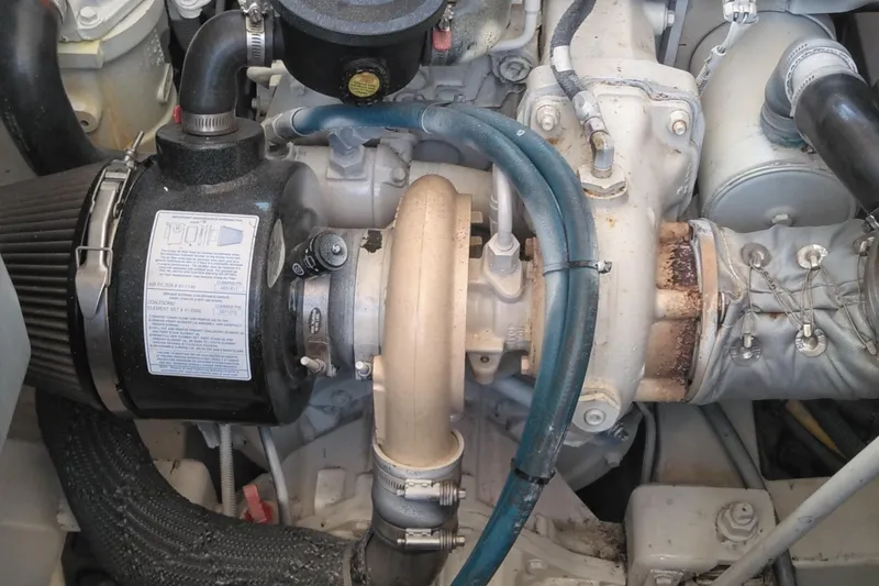 Slide: The Image of Engine components of a 2008 Legacy Yachts 32, showcasing detailed mechanical parts. - 65