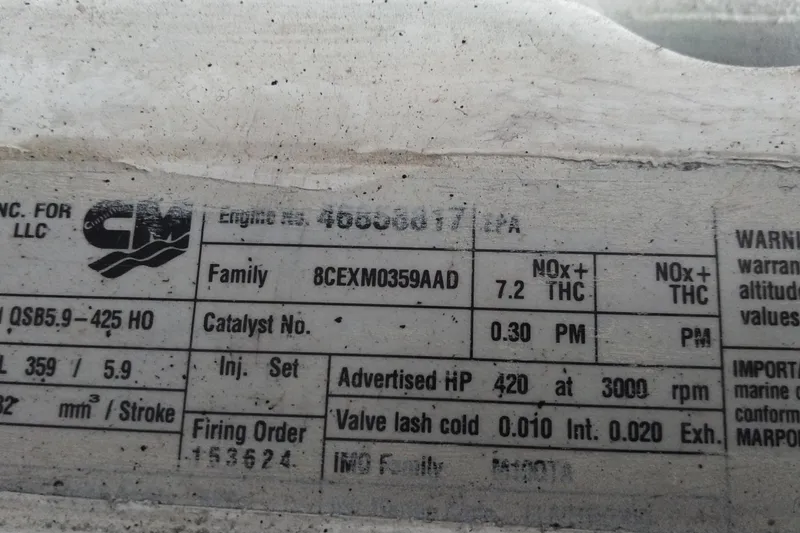 Slide: The Image of Close-up of engine specifications label on a 2008 Legacy Yachts 32. - 68