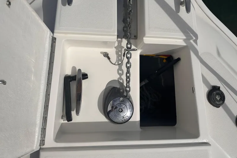 Slide: The Image of Anchor locker of a 2005 Silverton 42 Convertible boat with chain and winch. - 11