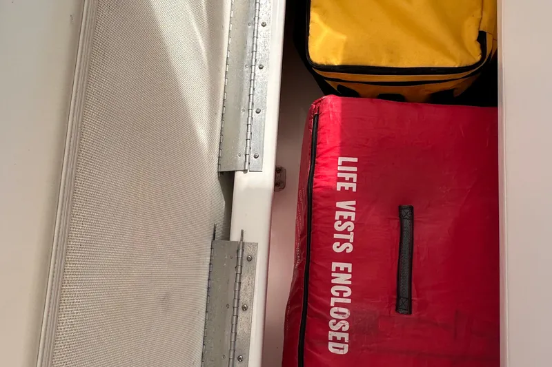 Slide: The Image of Storage compartment on a 2005 Silverton 42 Convertible with life vests enclosed. - 15
