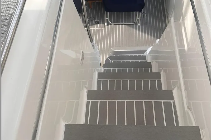 Slide: The Image of Staircase on 2005 Silverton 42 Convertible yacht with sleek, modern design. - 21