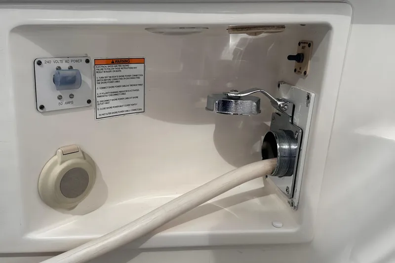 Slide: The Image of 2005 Silverton 42 Convertible boat power connection panel with 240 volts AC, 50 amps. - 25