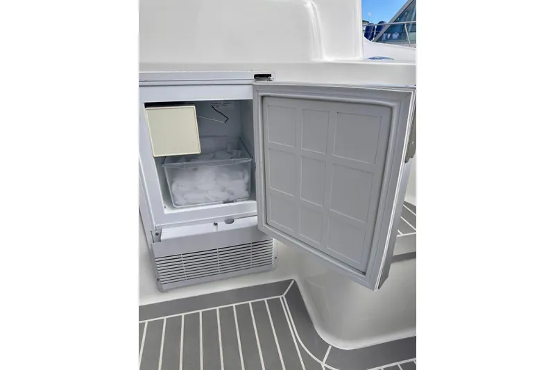 Slide: The Image of Open ice maker on 2005 Silverton 42 Convertible yacht, showing ice compartment. - 29