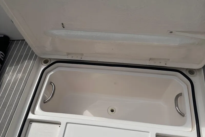 Slide: The Image of Open storage compartment on 2005 Silverton 42 Convertible boat deck. - 32