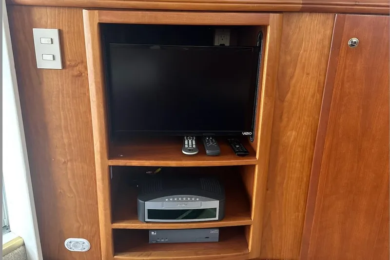 Slide: The Image of Entertainment system in 2005 Silverton 42 Convertible yacht with TV and audio equipment. - 34