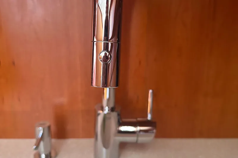 Slide: The Image of Chrome faucet in a 2004 Silverton 42 Convertible yacht kitchen. - 42
