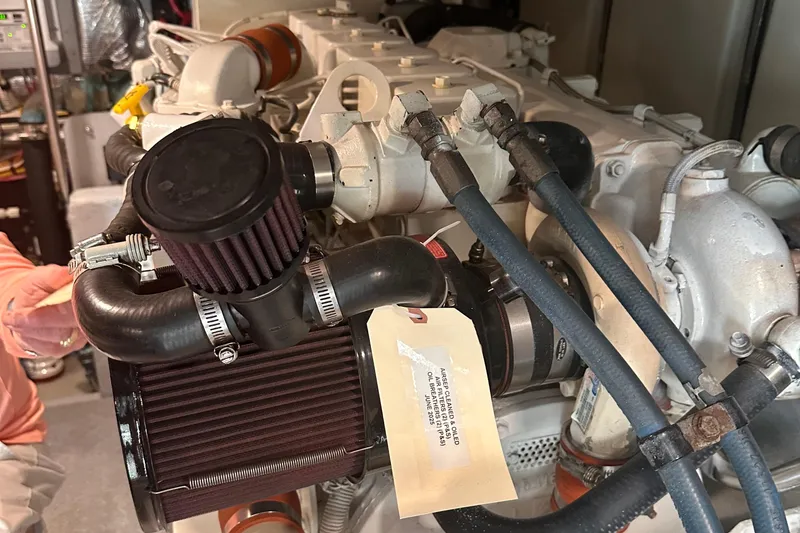 Slide: The Image of Engine compartment of a 2004 Silverton 42 Convertible boat, showcasing detailed components. - 57