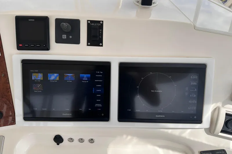 Slide: The Image of Garmin navigation screens on 2005 Silverton 42 Convertible yacht dashboard. - 6