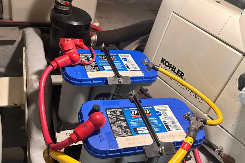 Slide: The Image of Engine room of 2004 Silverton 42 Convertible with Optima batteries and Kohler generator. - 61