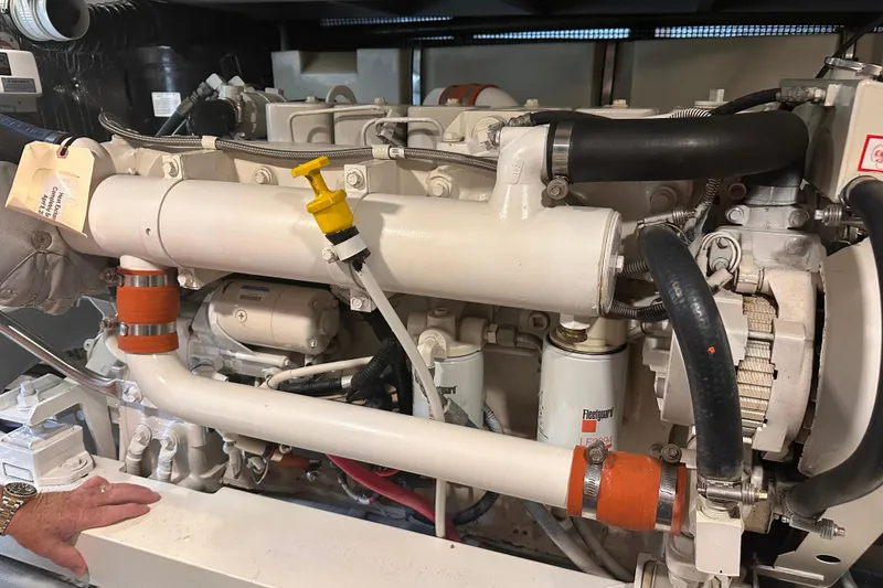 Slide: The Image of Engine compartment of a 2004 Silverton 42 Convertible yacht, showcasing mechanical components. - 65