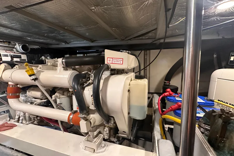 Slide: The Image of Engine room of a 2004 Silverton 42 Convertible yacht, showcasing machinery and components. - 66