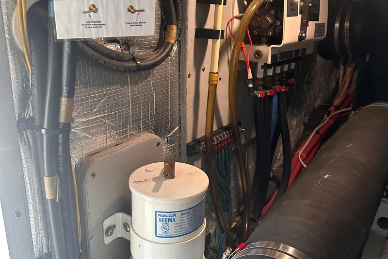 Slide: The Image of Engine room of a 2004 Silverton 42 Convertible with Racor fuel filter system. - 70